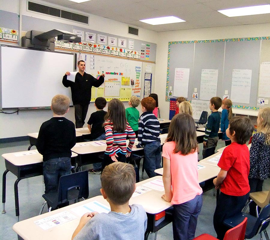 A CSL student leading an activity in an elementary classroom.