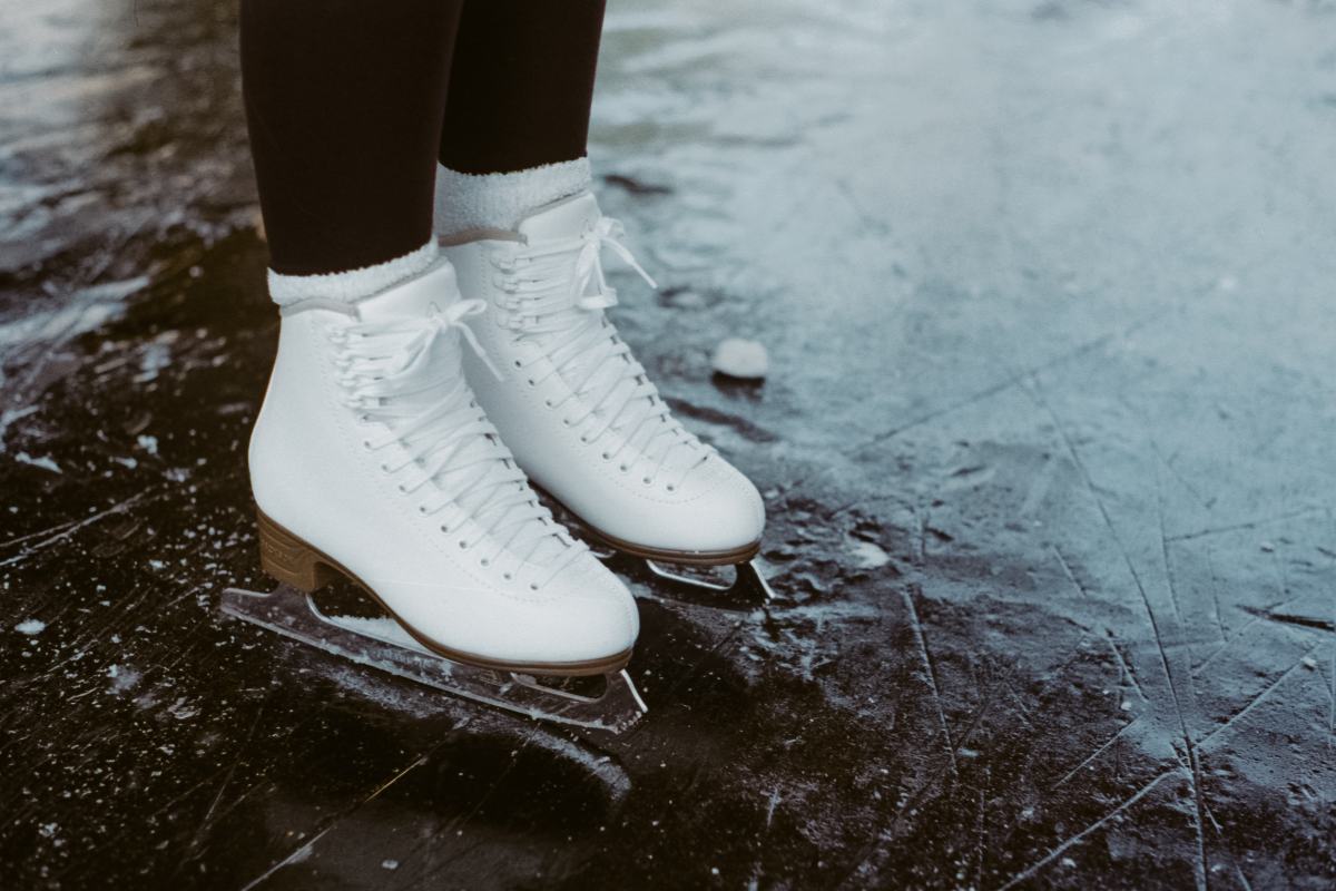 A person wearing skates standing on ice.