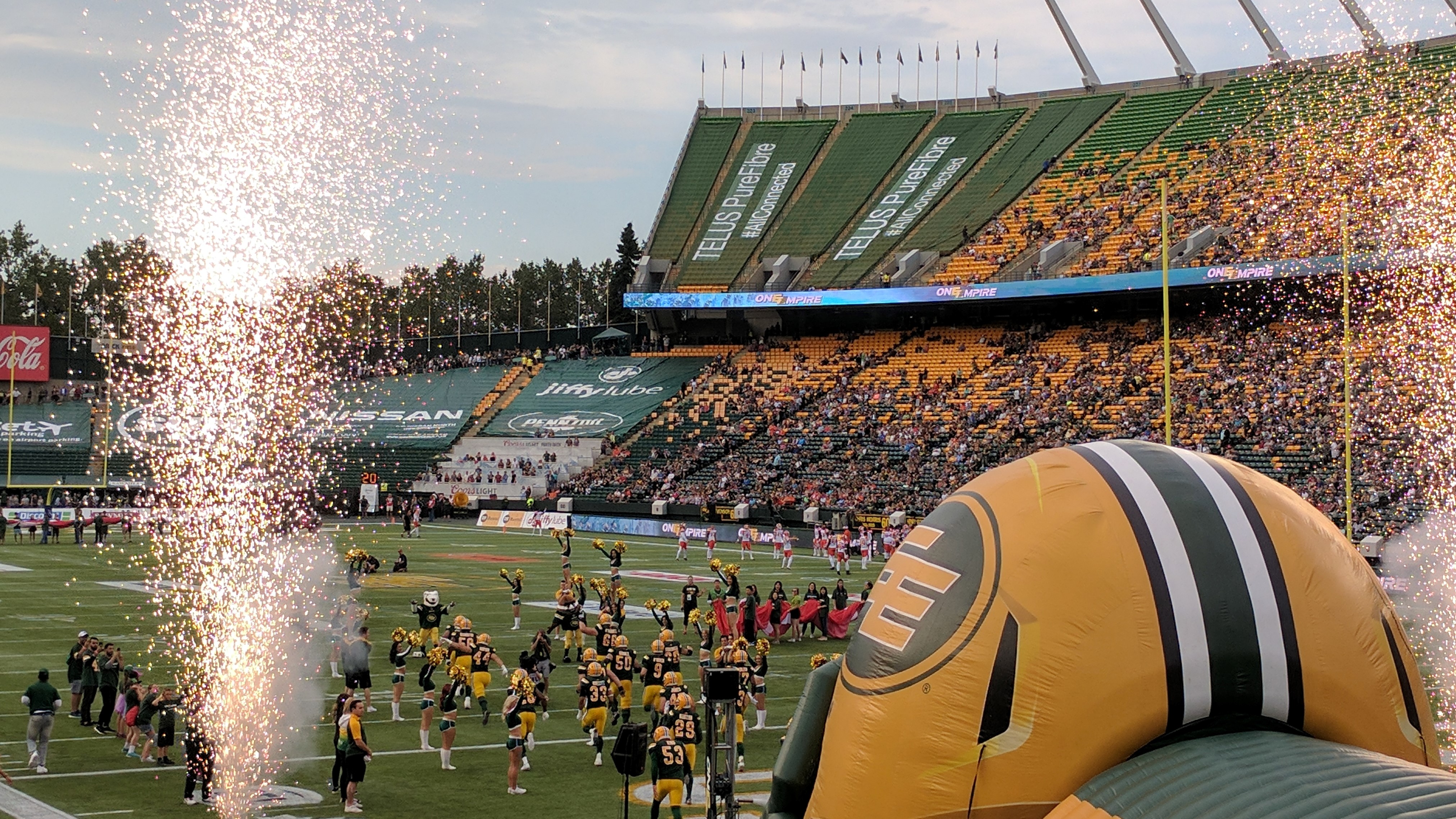 Edmonton Eskmos charge onto the field at a Canadian Football League game in July, 2017