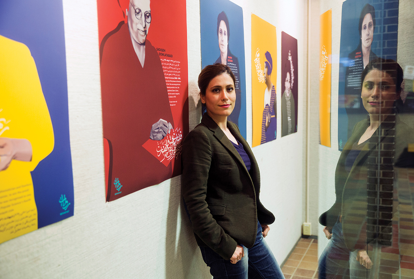 Photo of VCD student Zohreh Valiary Eskandary (Iran) with her thesis project display concerning the empowerment of young Iranian women