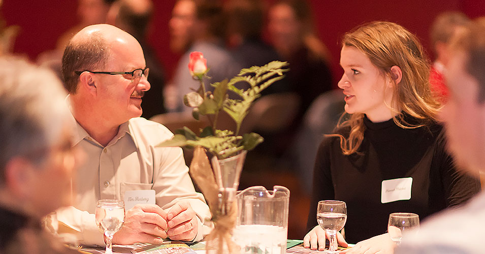A student and donor talking at the annual Community Awards Banquet