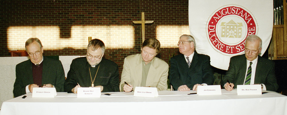 A picture may say a thousand words, but the picture above instead speaks of countless combined hours. On July 1, 2004, Augustana’s merger agreement with the University of Alberta was signed. From left to right: Augustana board chair Stanley Gooch, bishop Ray Shultz, MLA Lyle Oberg, U of A board chair Jim Edwards and U of A president Rod Fraser.