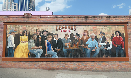 A photo of the Legends mural in Nashville featuring paintings of various country music stars.