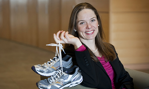 Photo of Jane Yardley with a pair of running shoes.