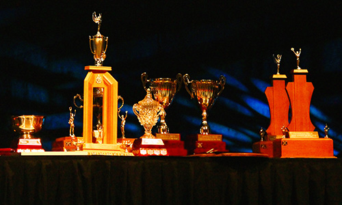A close up shot of trophies.