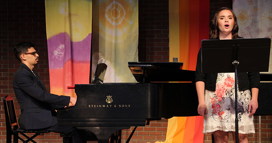 A photo of a student pianist accompanying a student singer