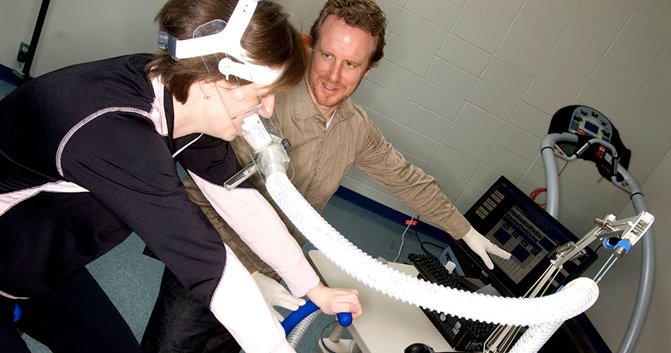 A photo of an instructor demonstrating how equipment works.