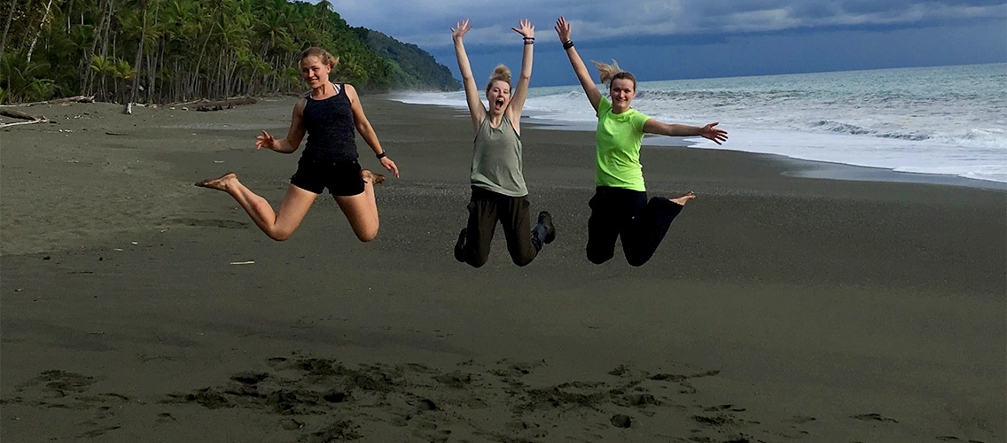A photo of Sydney and some friends on a beach in Costa Rica