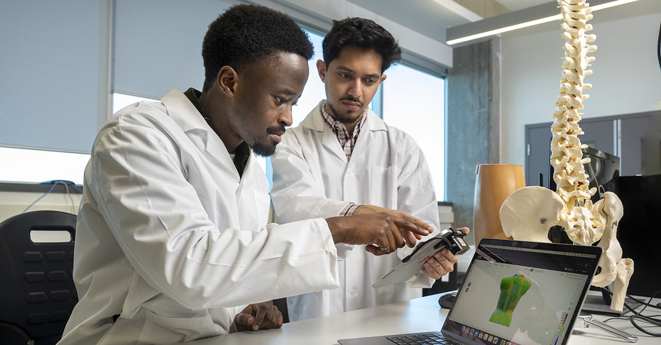 Students in a lab review biomedical information.