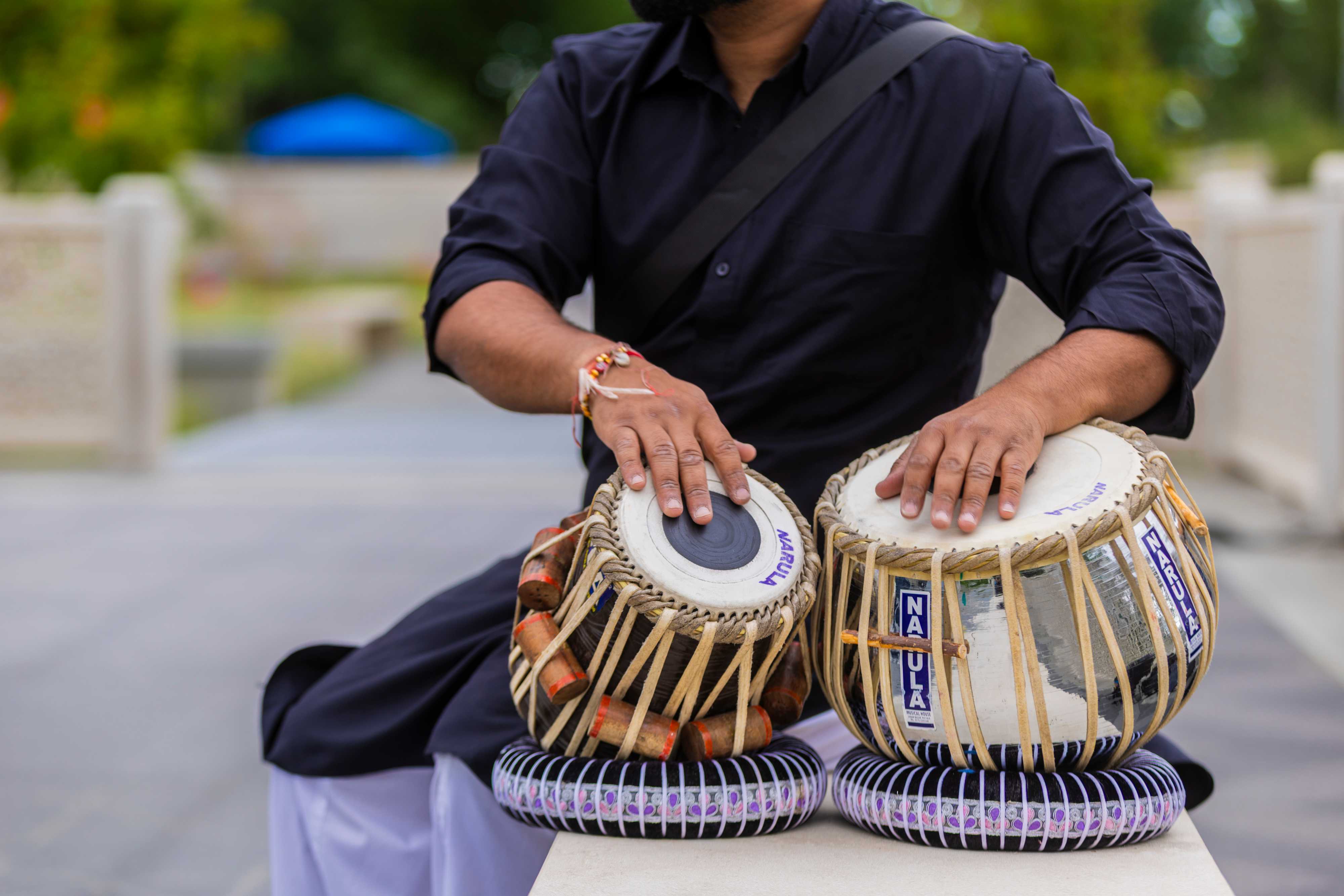 Close up of man drumming on hand drum