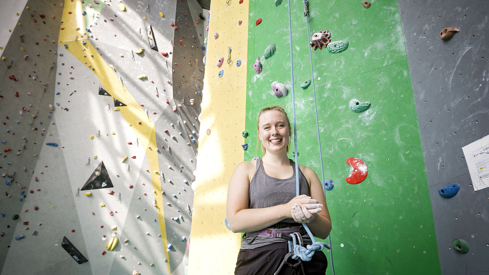  Anna Steenwinkle stands in front of the climbing wall at the Wilson Climbing Centre