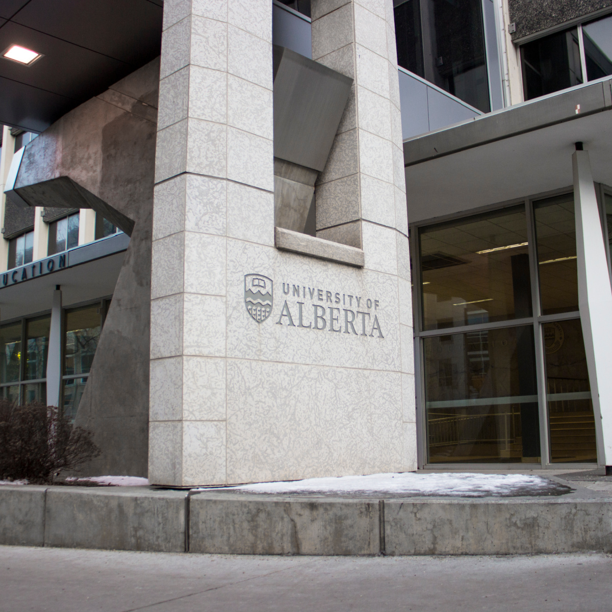 University of Alberta logo engrave on pillar by the entrance to the Faculty of Education