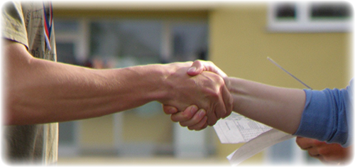 Mentor and student teacher shaking hands