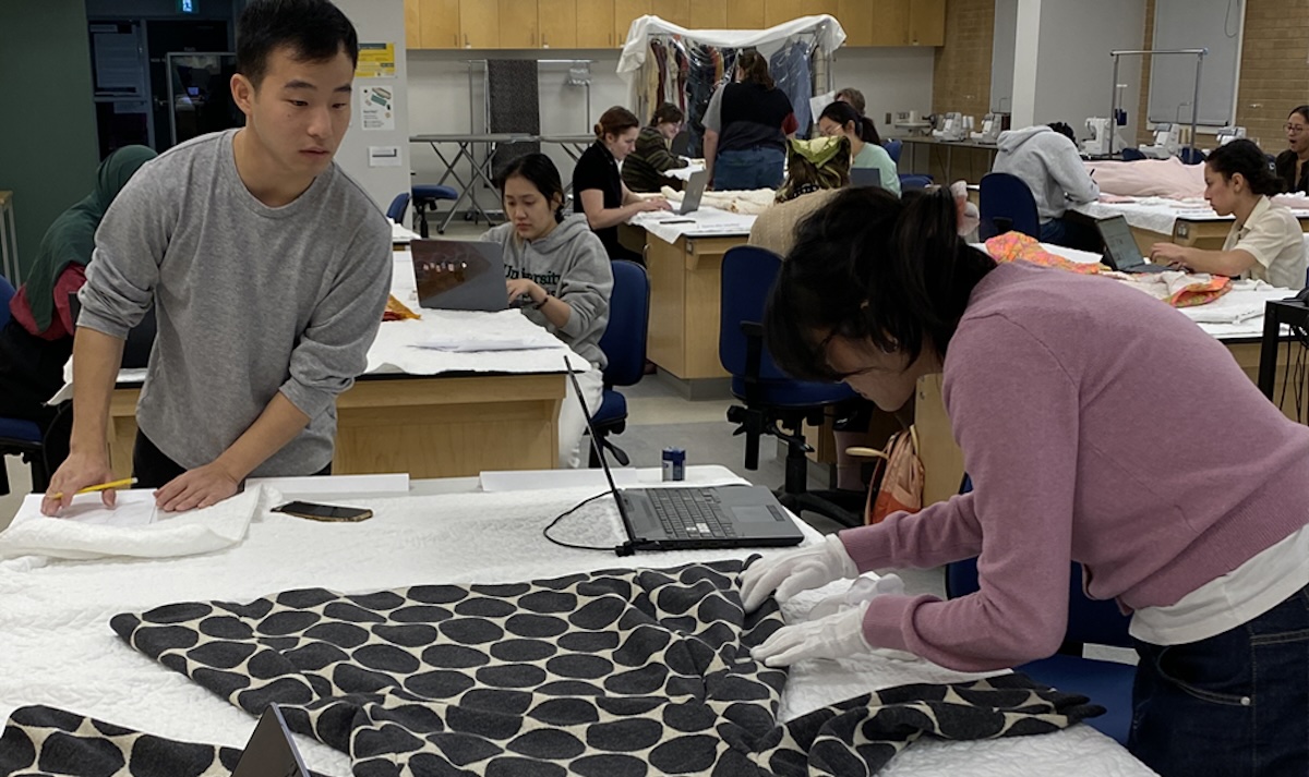 Students working with textile conservation