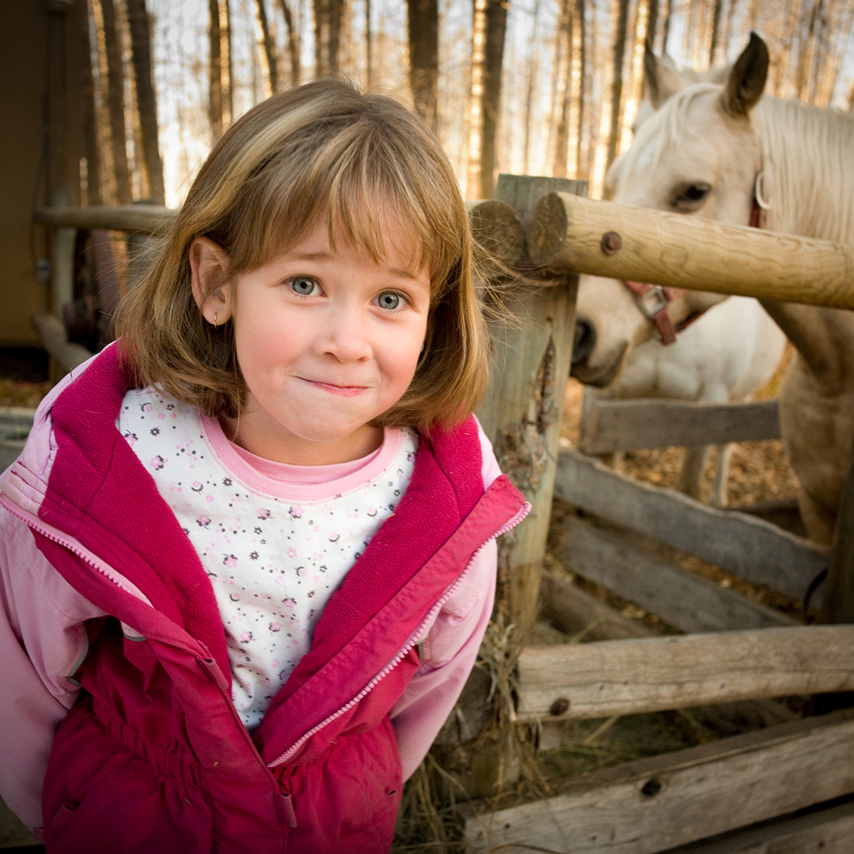 Kailan standing near a horse in 2007.