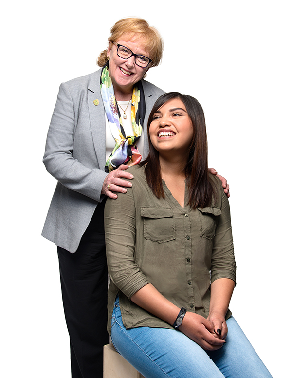 Lori West with her hand on the shoulder of Keisha.