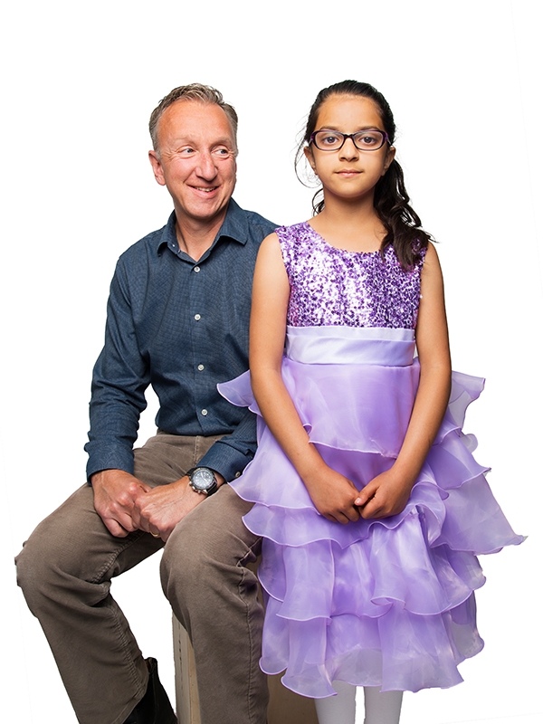 Peter Light sitting next to a standing Siyapreet.