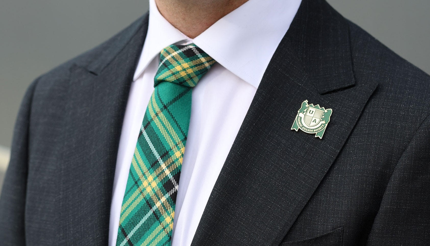 Alumni Awards Society Pin on a jacket