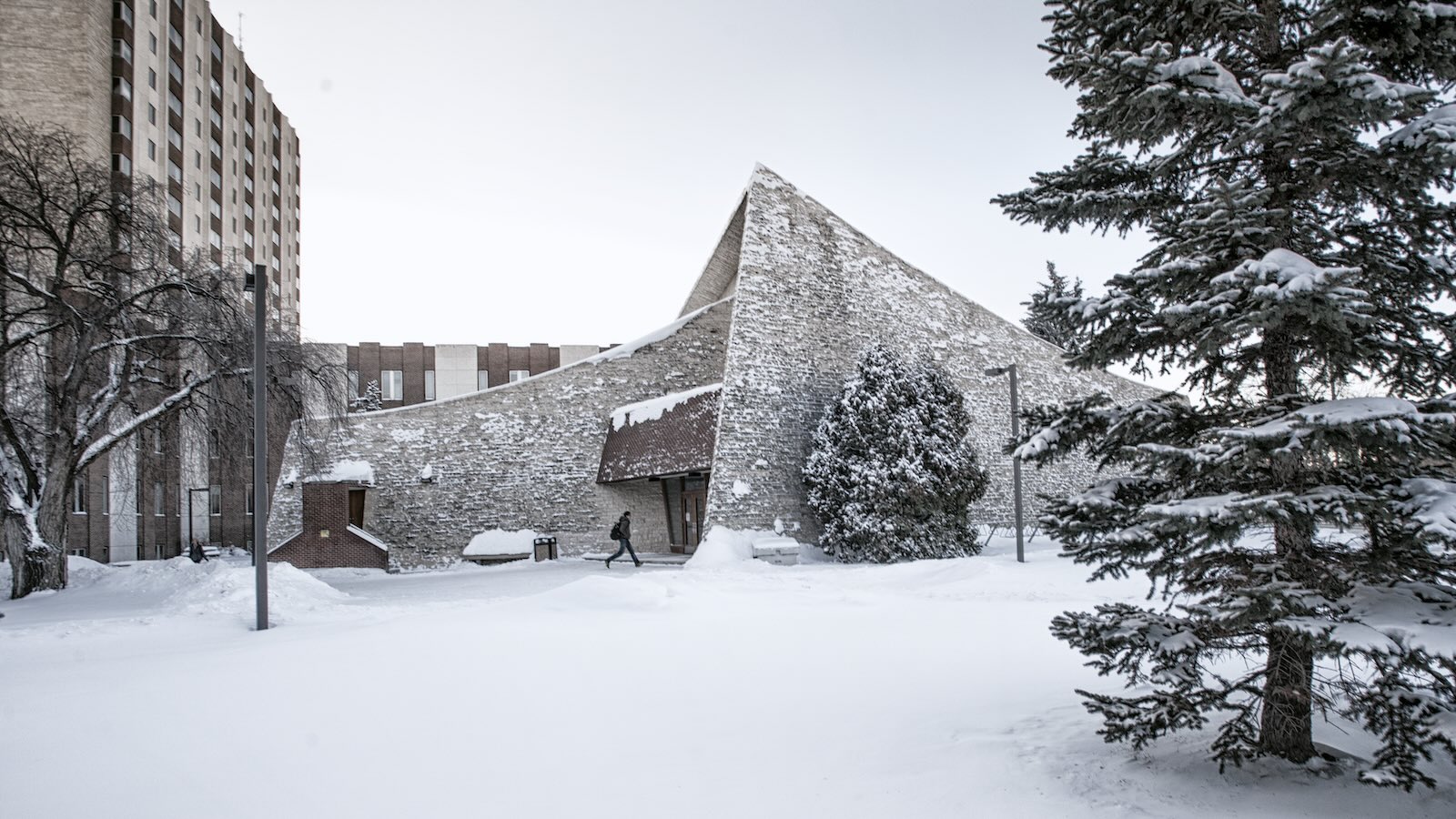 Tory Lecture Theatre in Winter with student walking