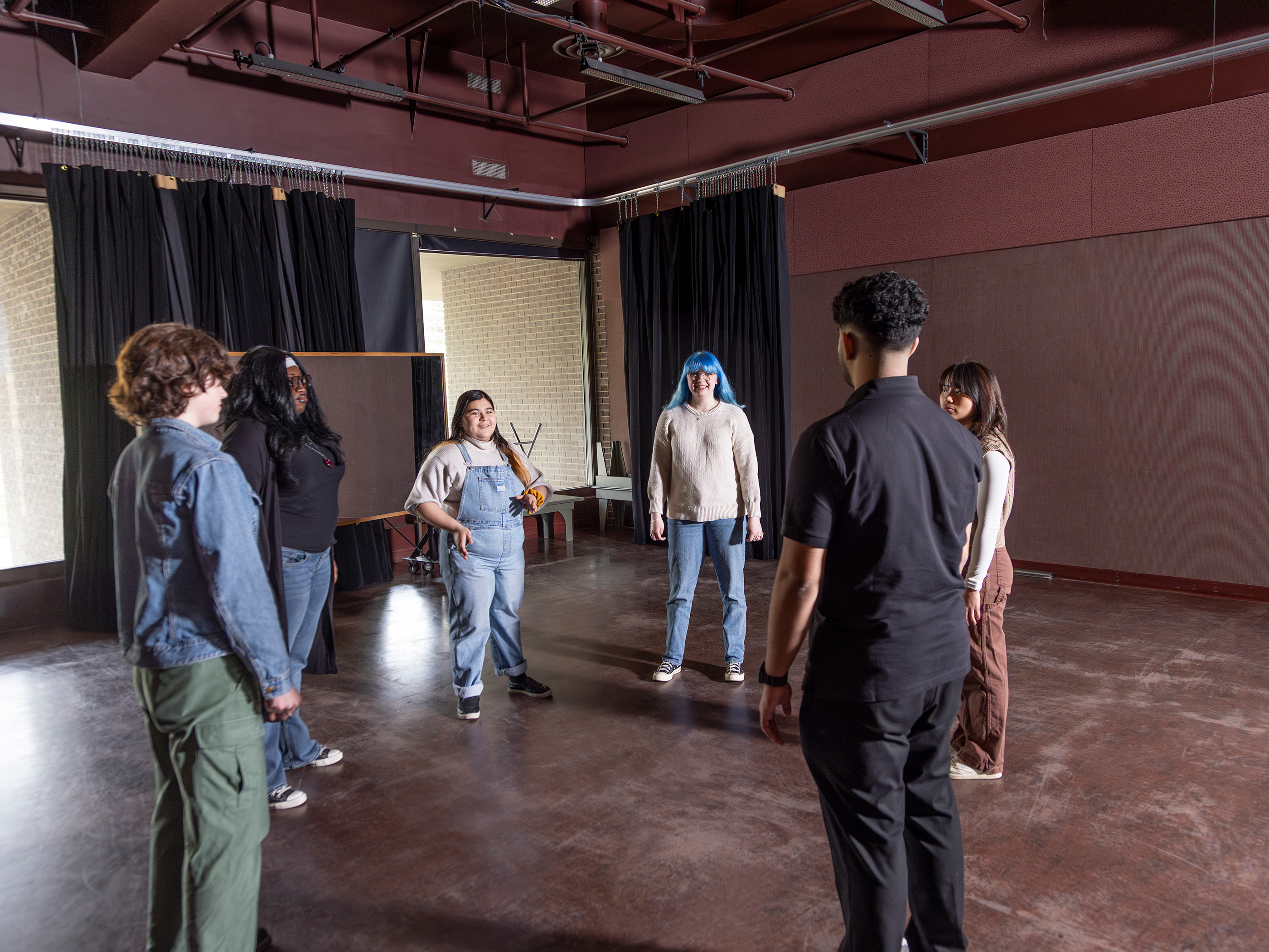 Students in a rehearsal space.