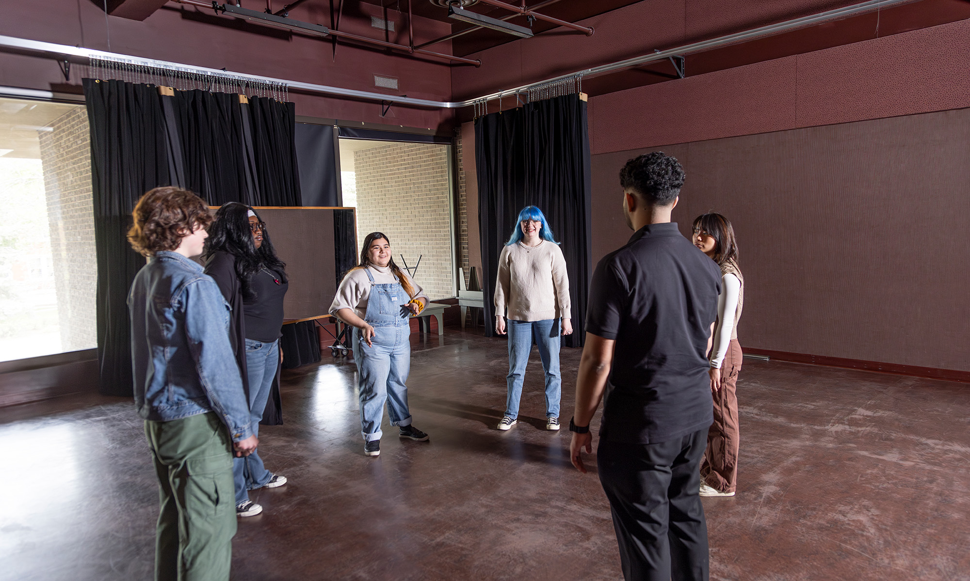 Students in a rehearsal space.