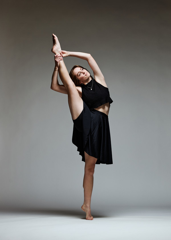 An image of Sarah Dolman, BA 2026, holding her foot over her head