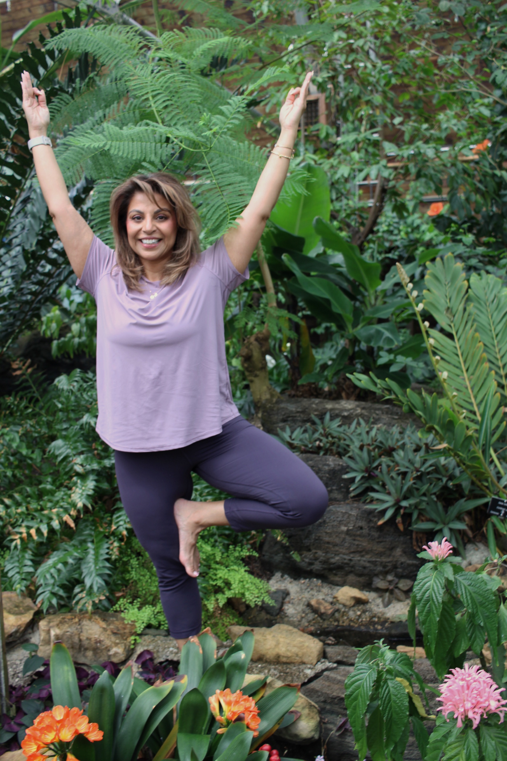 Yoga teacher in the Tropical Showhouse