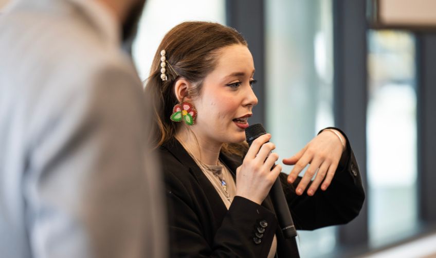An indigenous student is presenting at a case competition