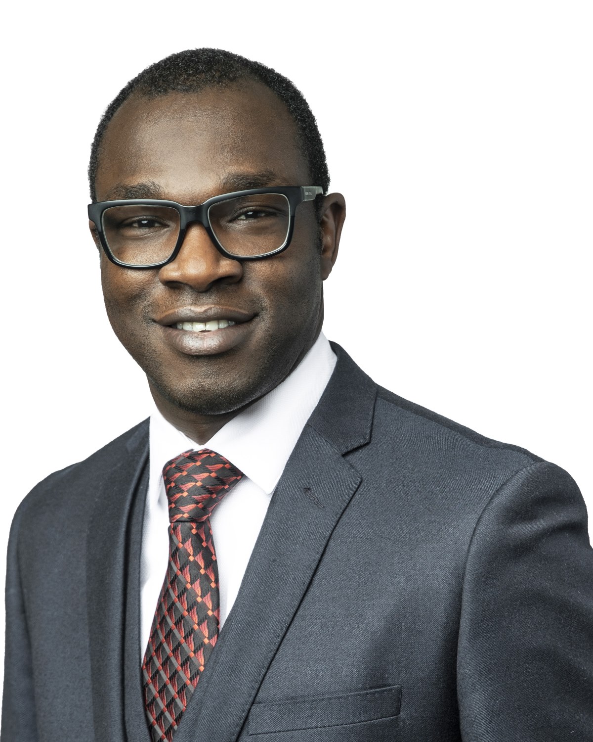 Olugbenga Ibikunle headshot in front of a white background wearing a grey suit and glasses.