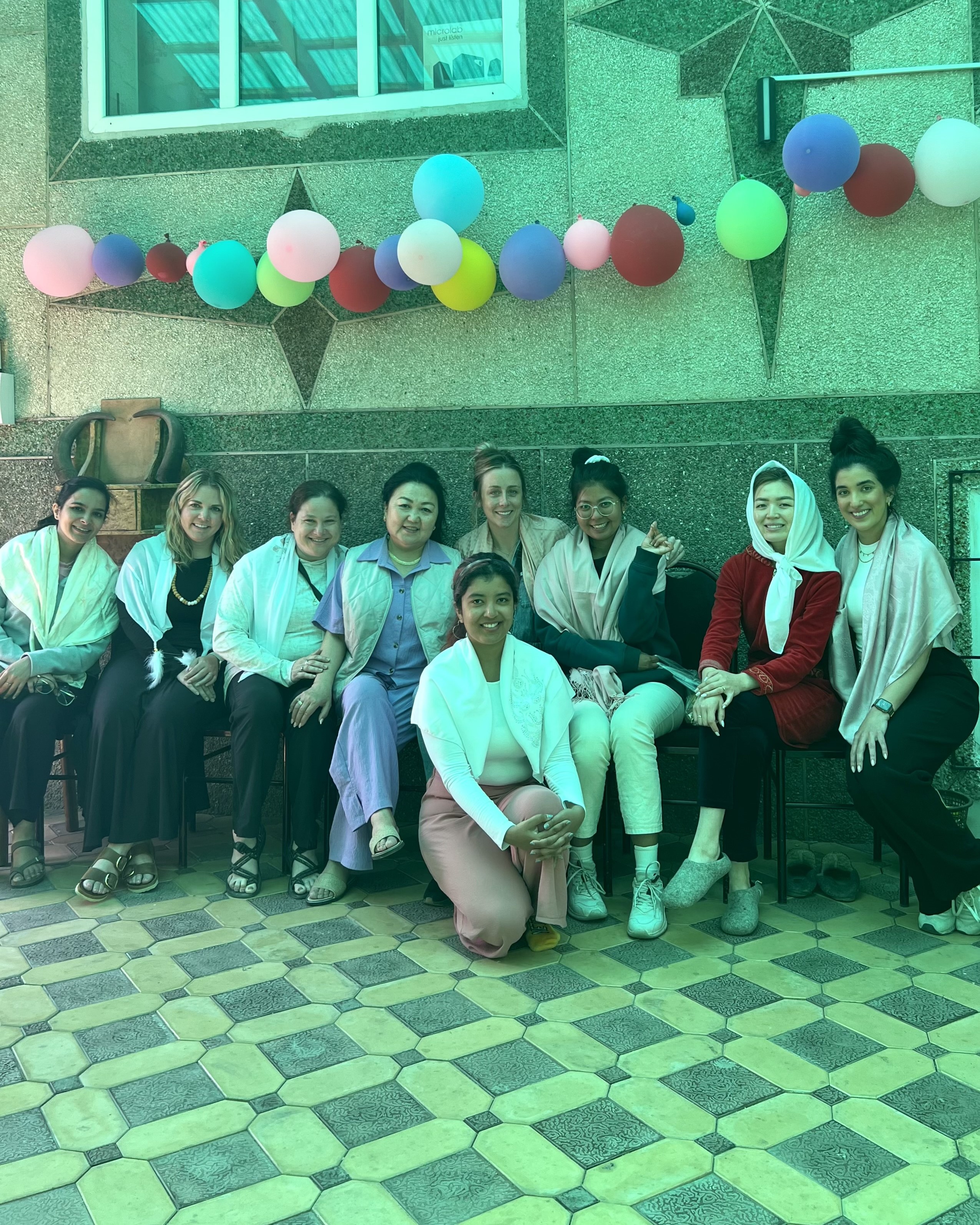 image of Sam with a group of people while on the business on the frontlines program