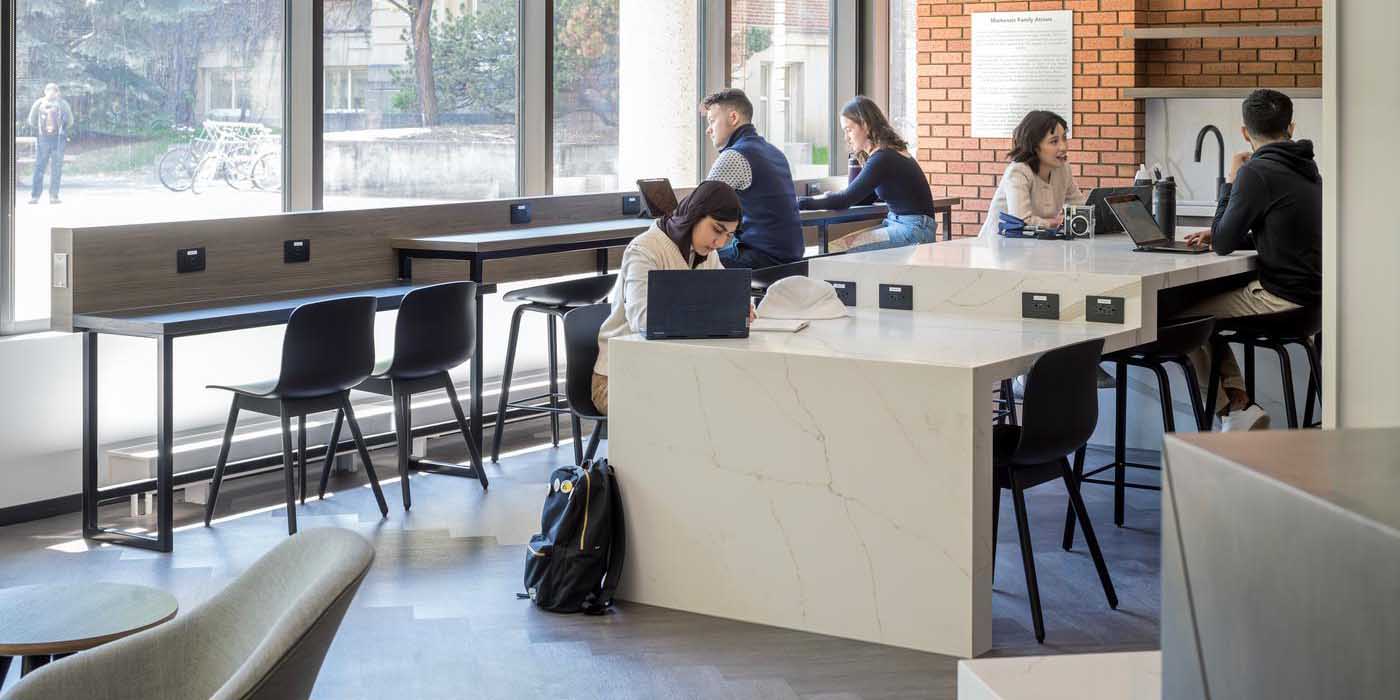 People in Alberta School of Business Carruthers Student Commons. Copyright Christy Dean