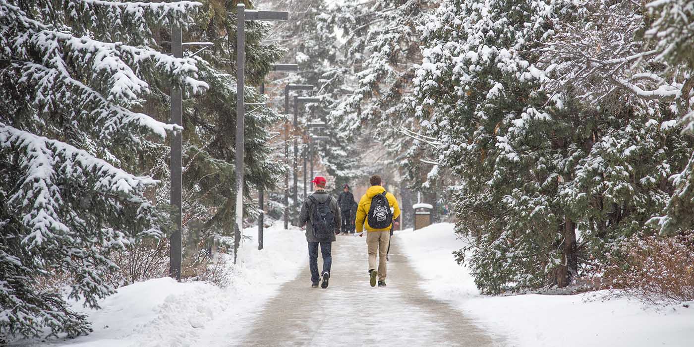 Students walking on campus in the winter