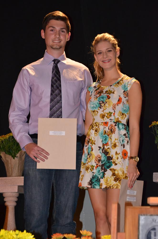 Nicholas Galech and Stefania Kostiuk, M. E Lazerte High School graduates, receiving their certificates during the award ceremony at the school