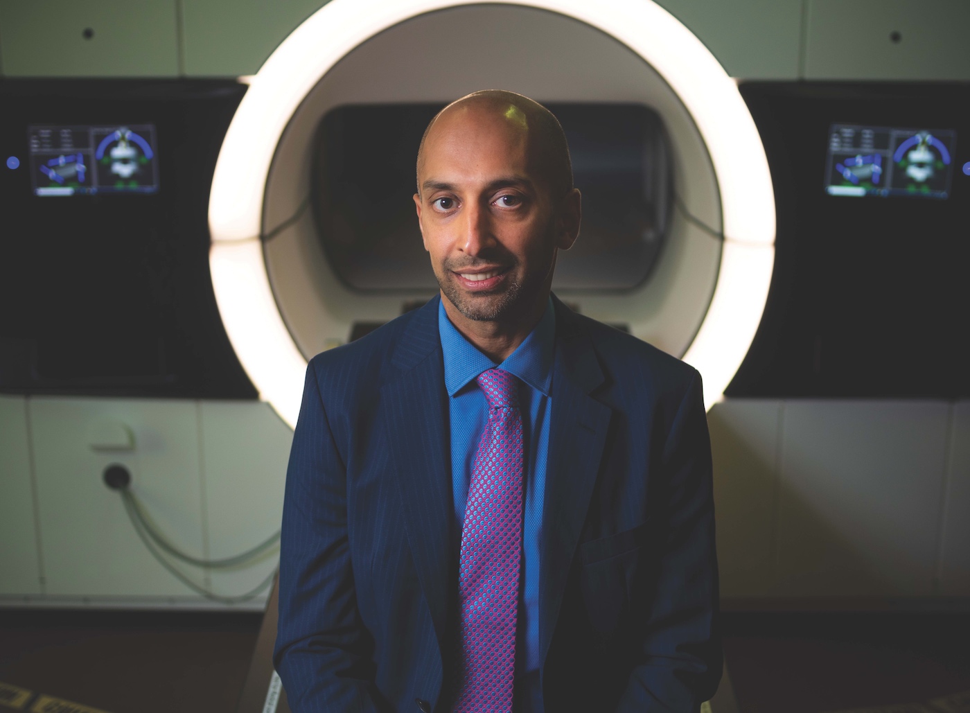 Nawaid Usmani in front of an MRI machine