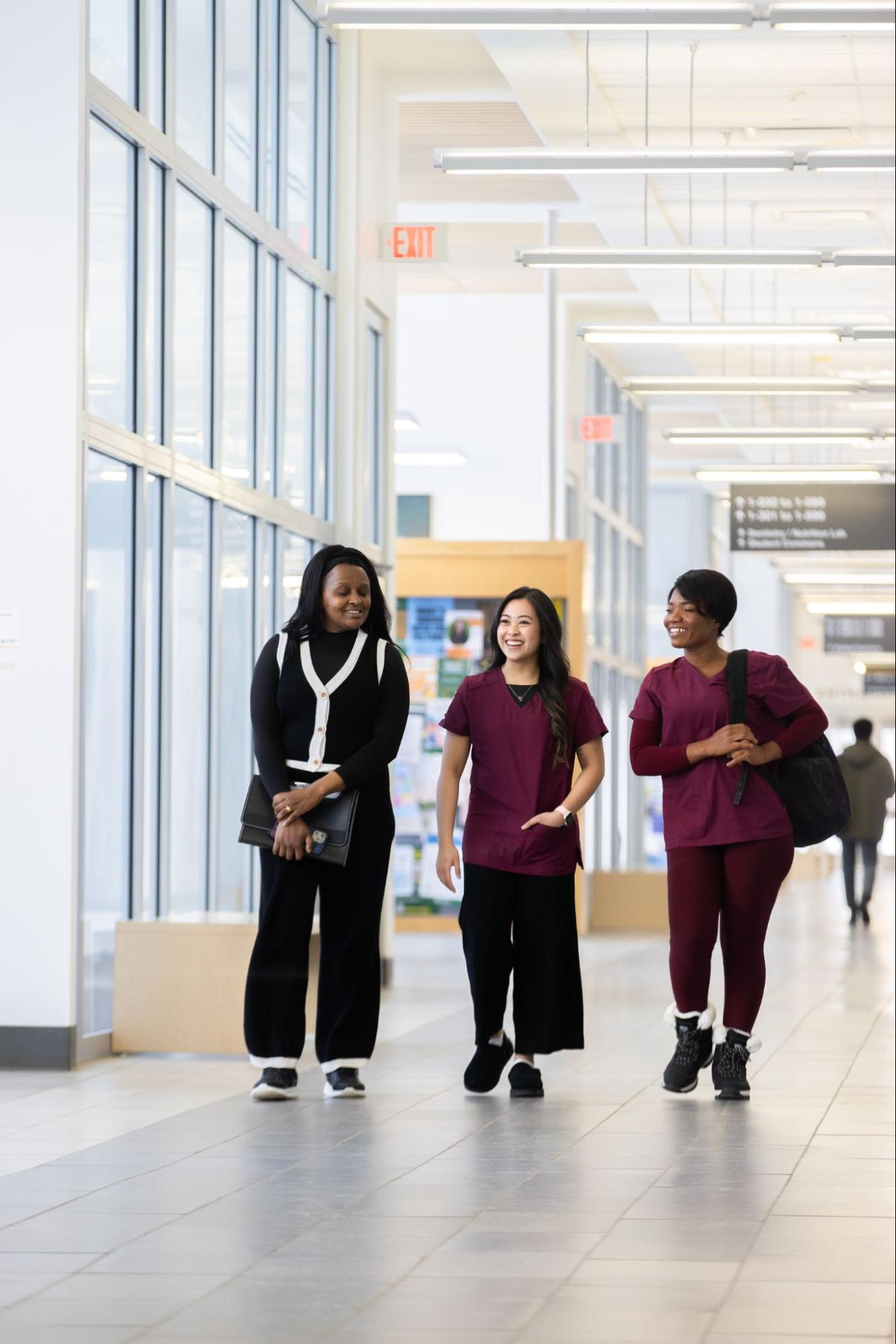 nursing students walking in a hallway