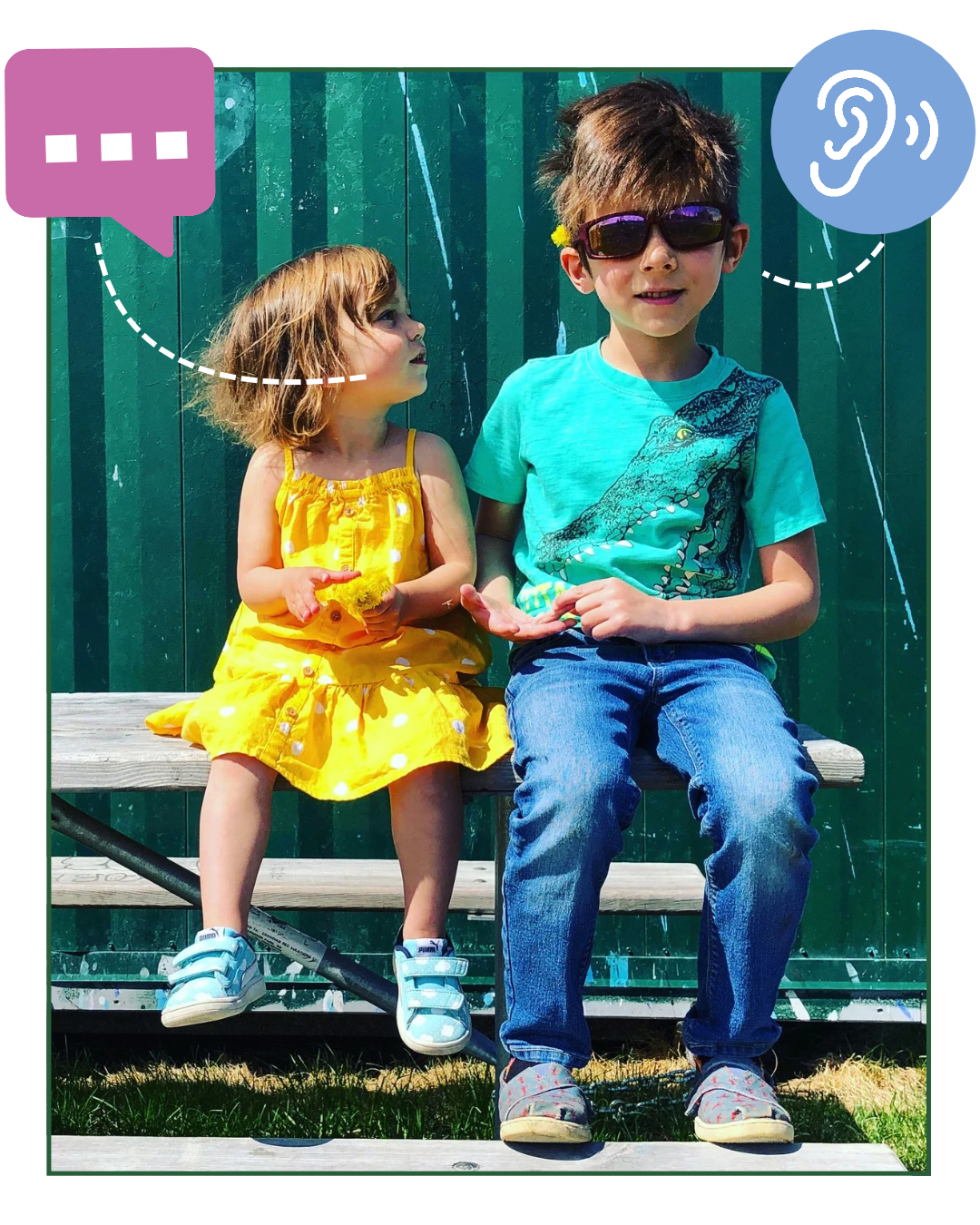 Two children sitting in a park.