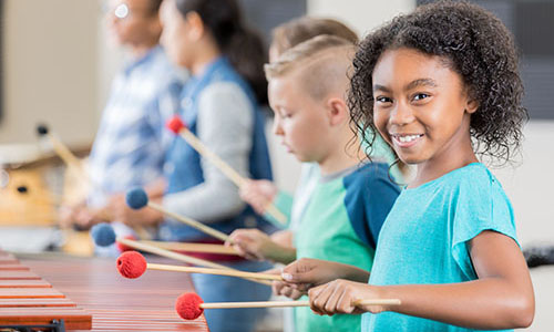 Child playing instrument