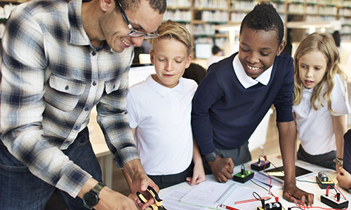 Librarian showing resources to students