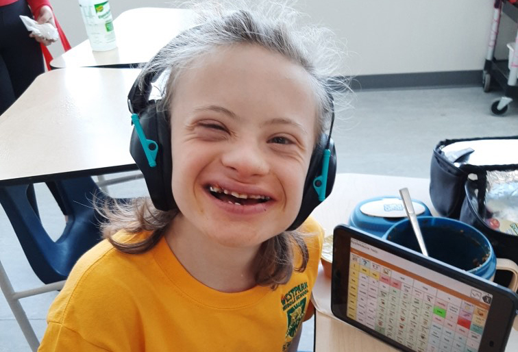 Student using AAC in classroom