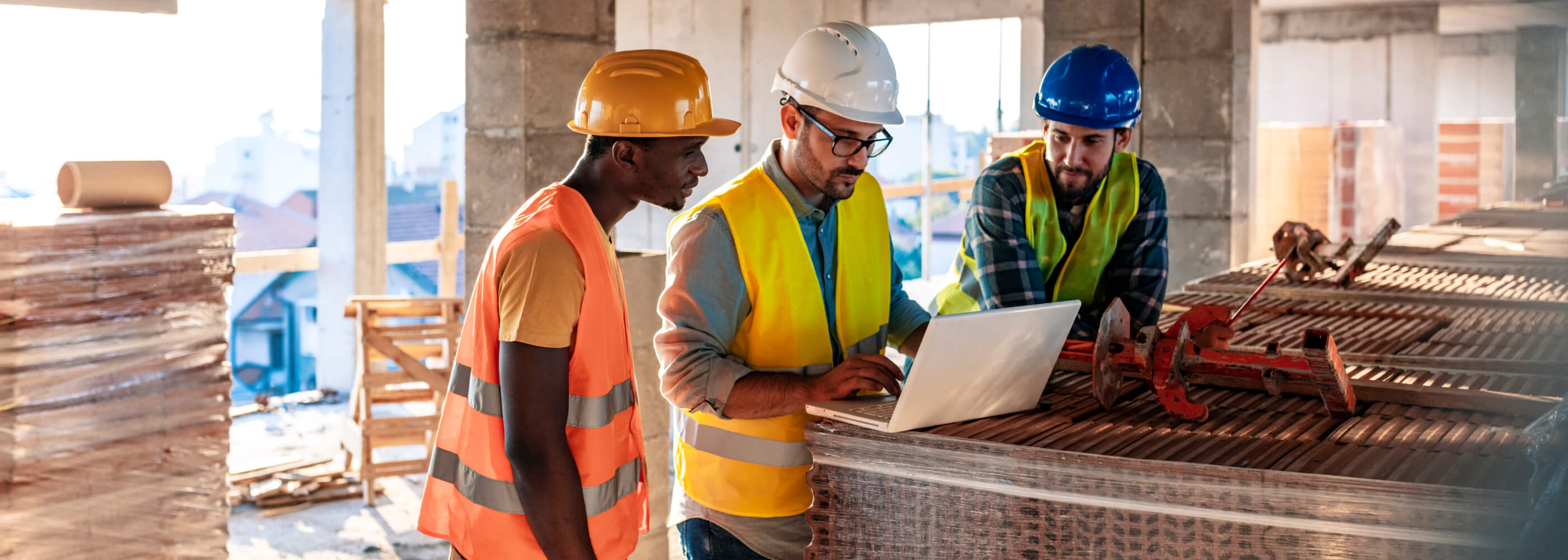 Workers at construction job site inside building 