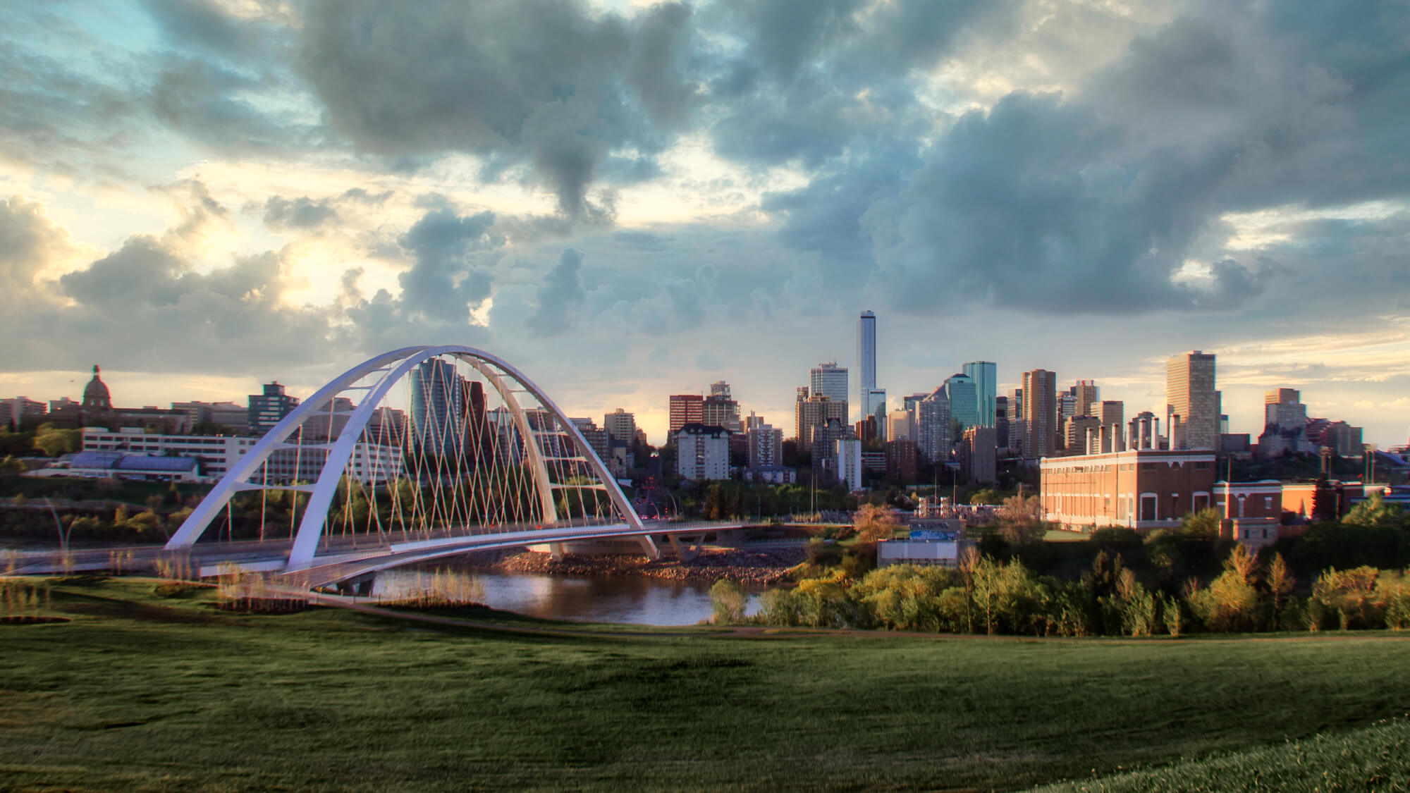 View of bridge over river against cloudy sky,Edmonton,Alberta,Canada