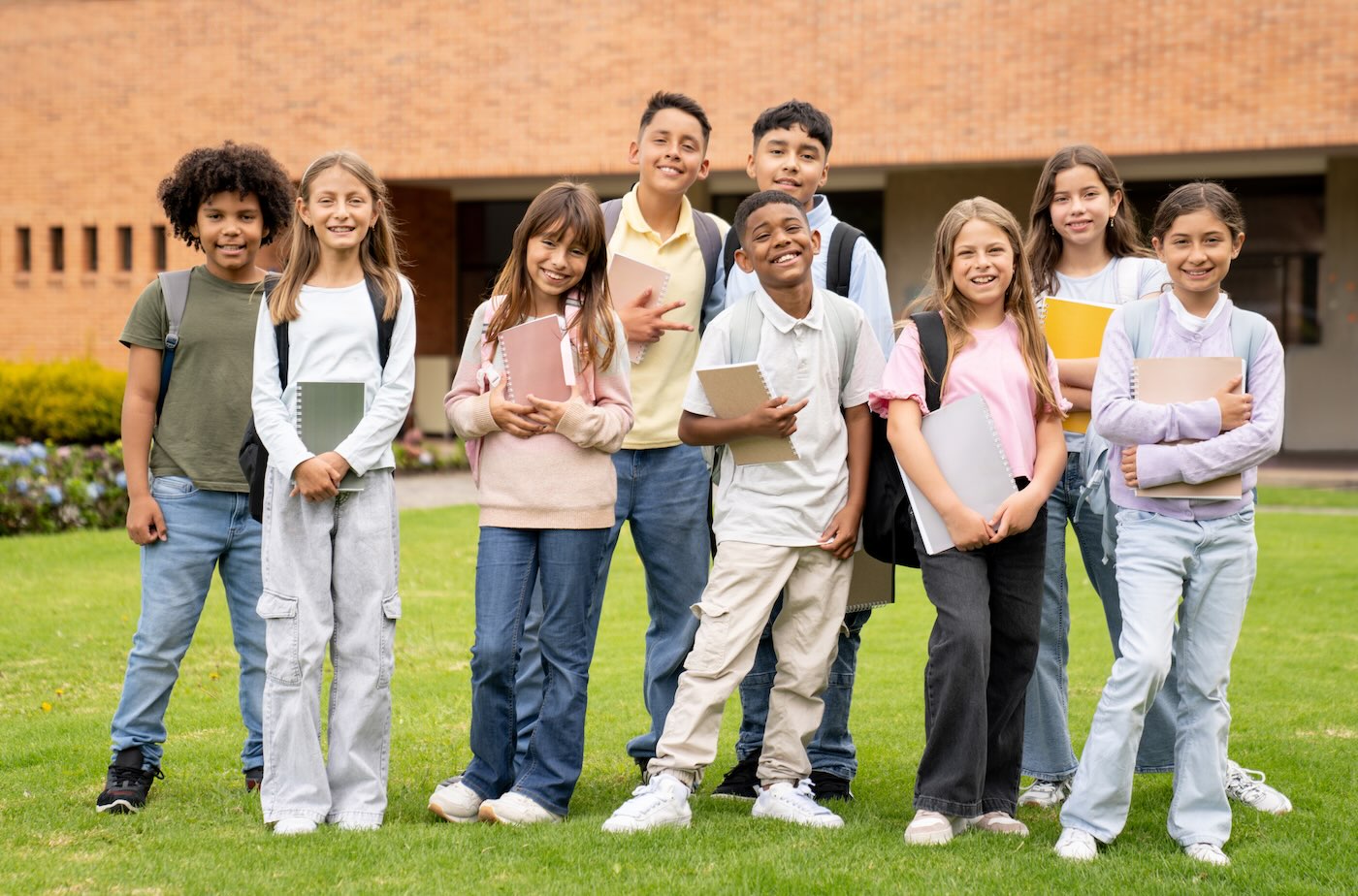 Group of children holding notebooks