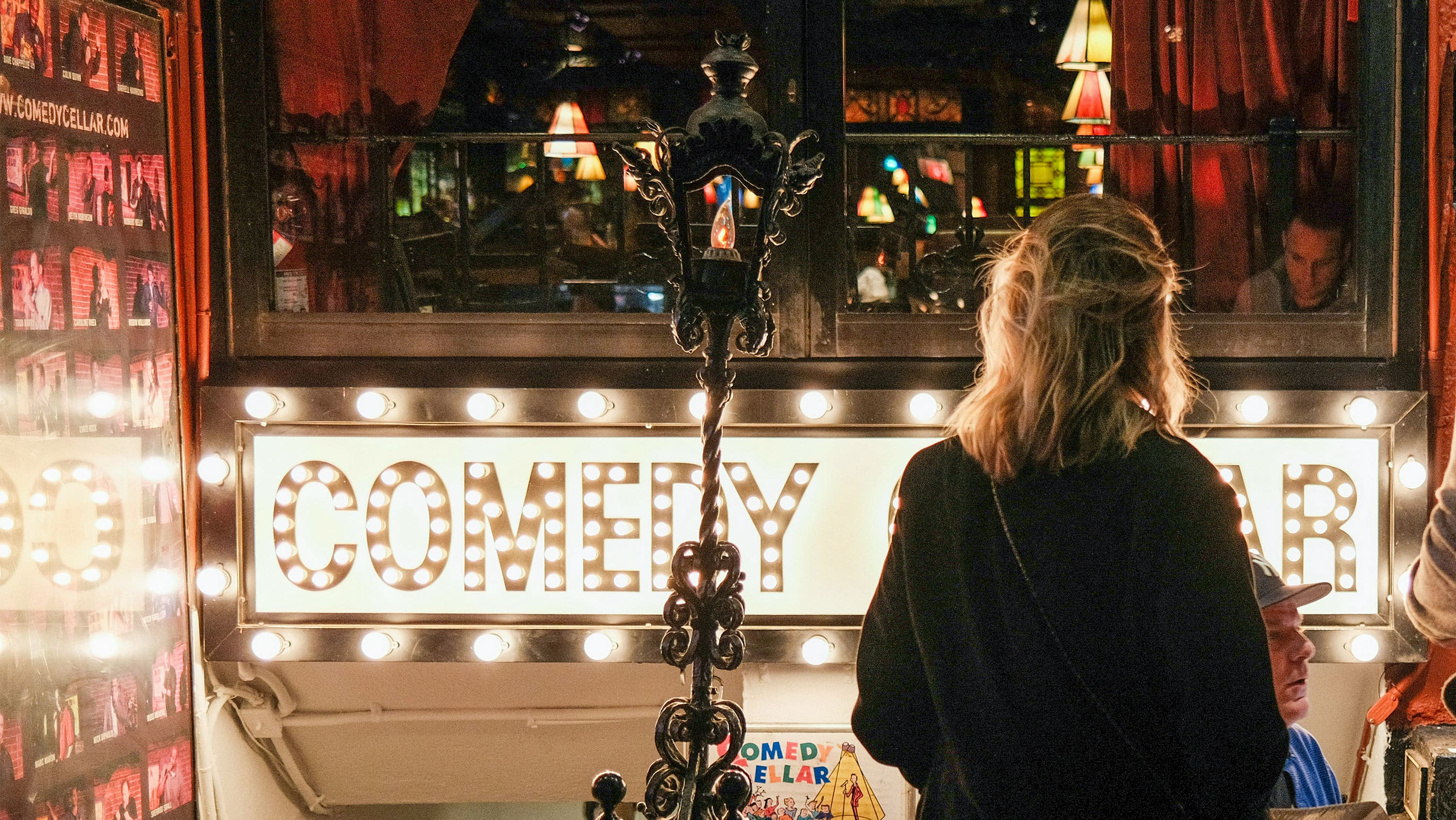 A young woman walks down into the Comedy Cellar. (Photo: Unsplash)
