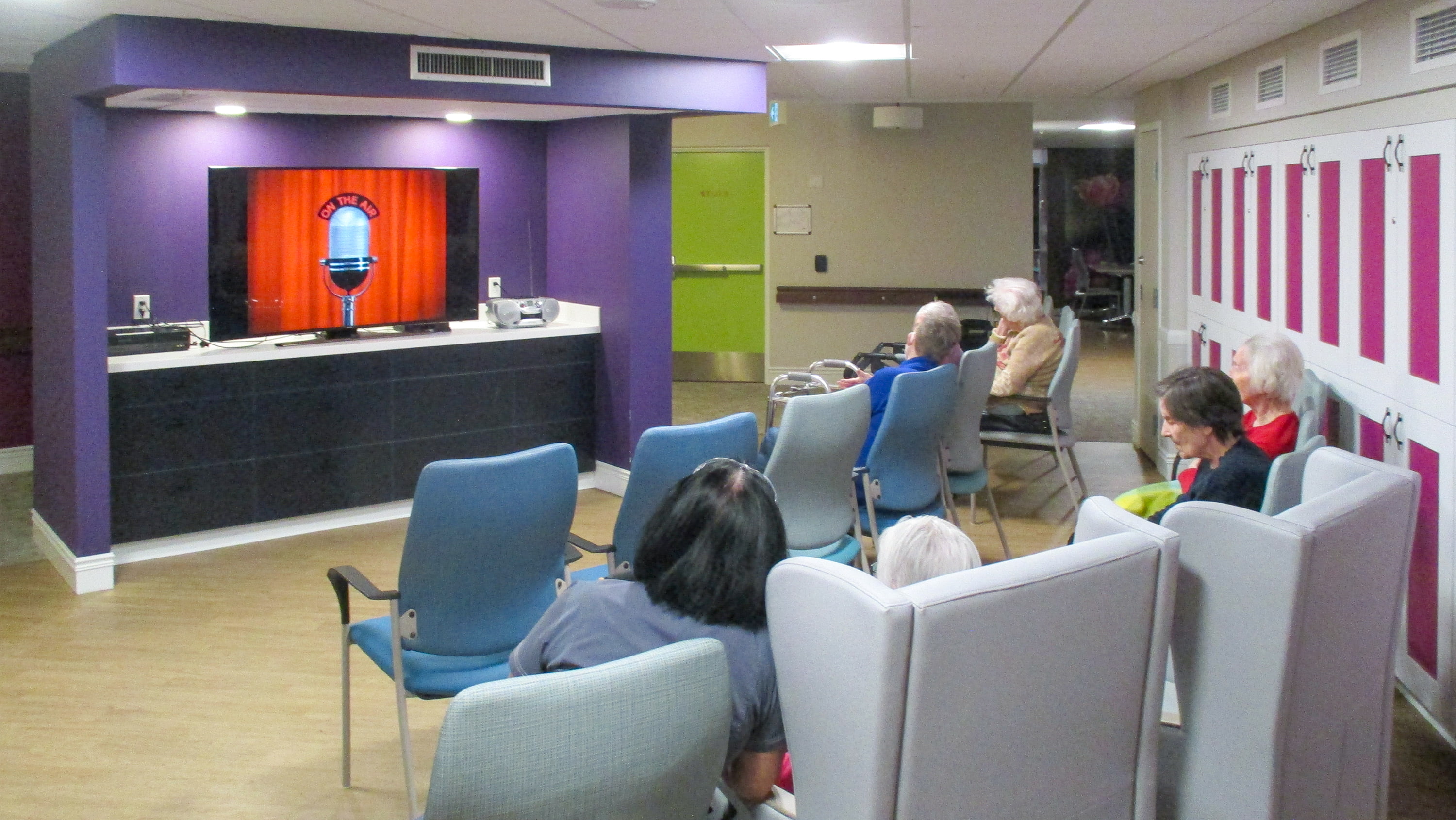 Residents of Canterbury Lane sit in a space designed to look like an old-time auditorium. (Photo courtesy of the Canterbury Foundation)