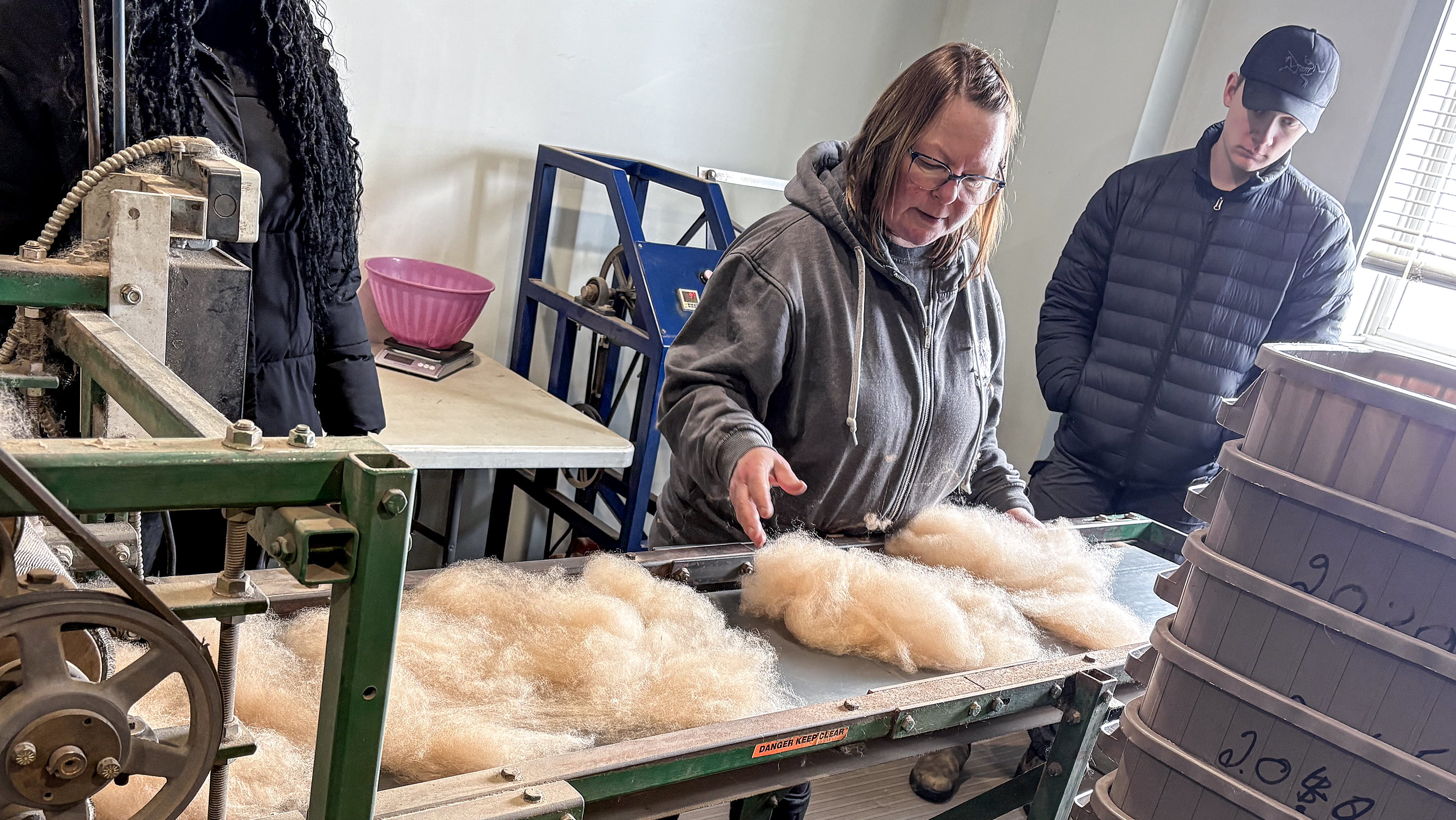 Leanne Sept (centre), co-founder of Twisted Sisters & Company Fiber Mill, says working with Augustana students is giving her company a valuable voice as a small family business in rural Alberta. (Photo: Supplied)  