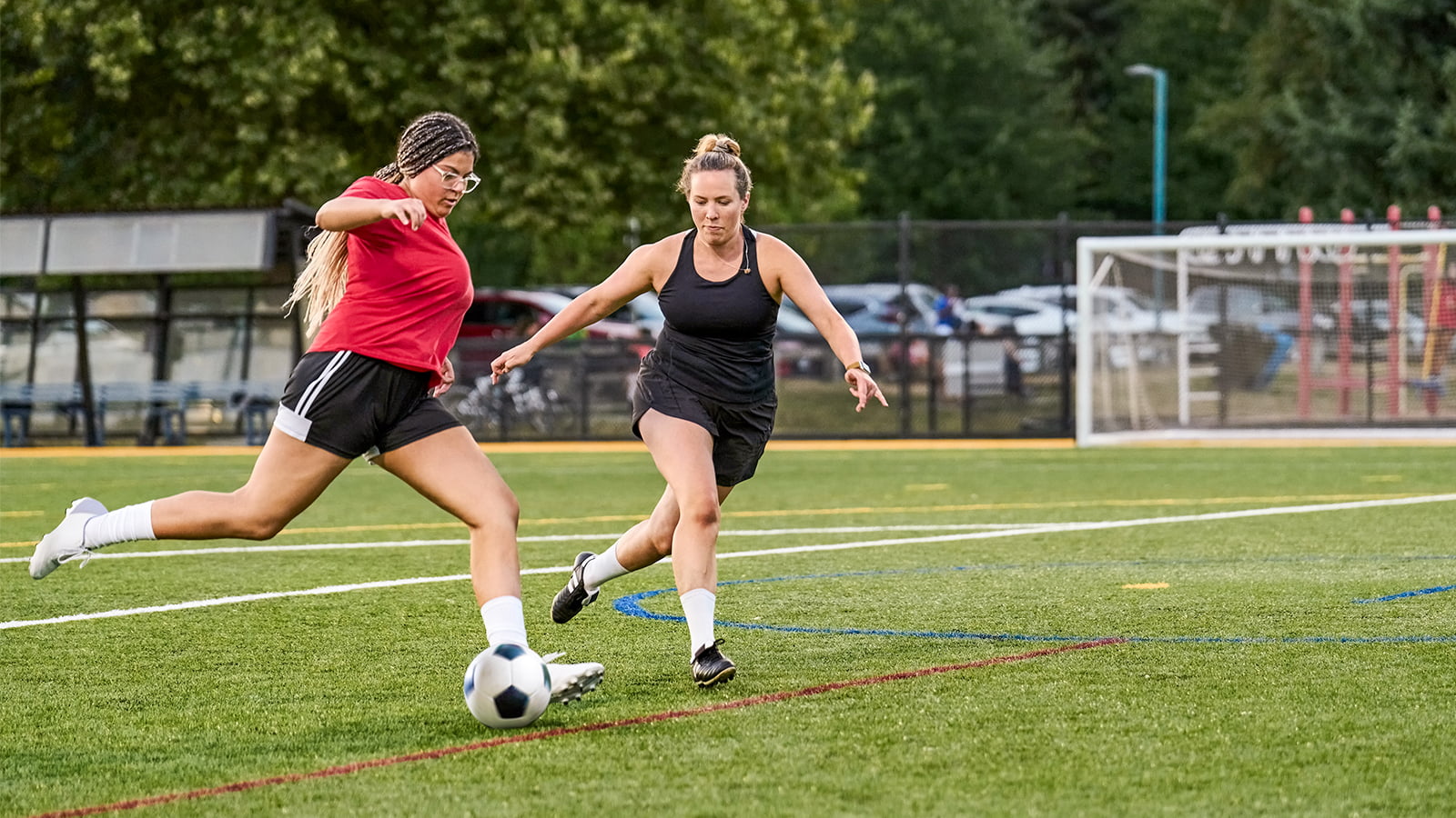 Two women play soccer. (Photo: Getty Images)