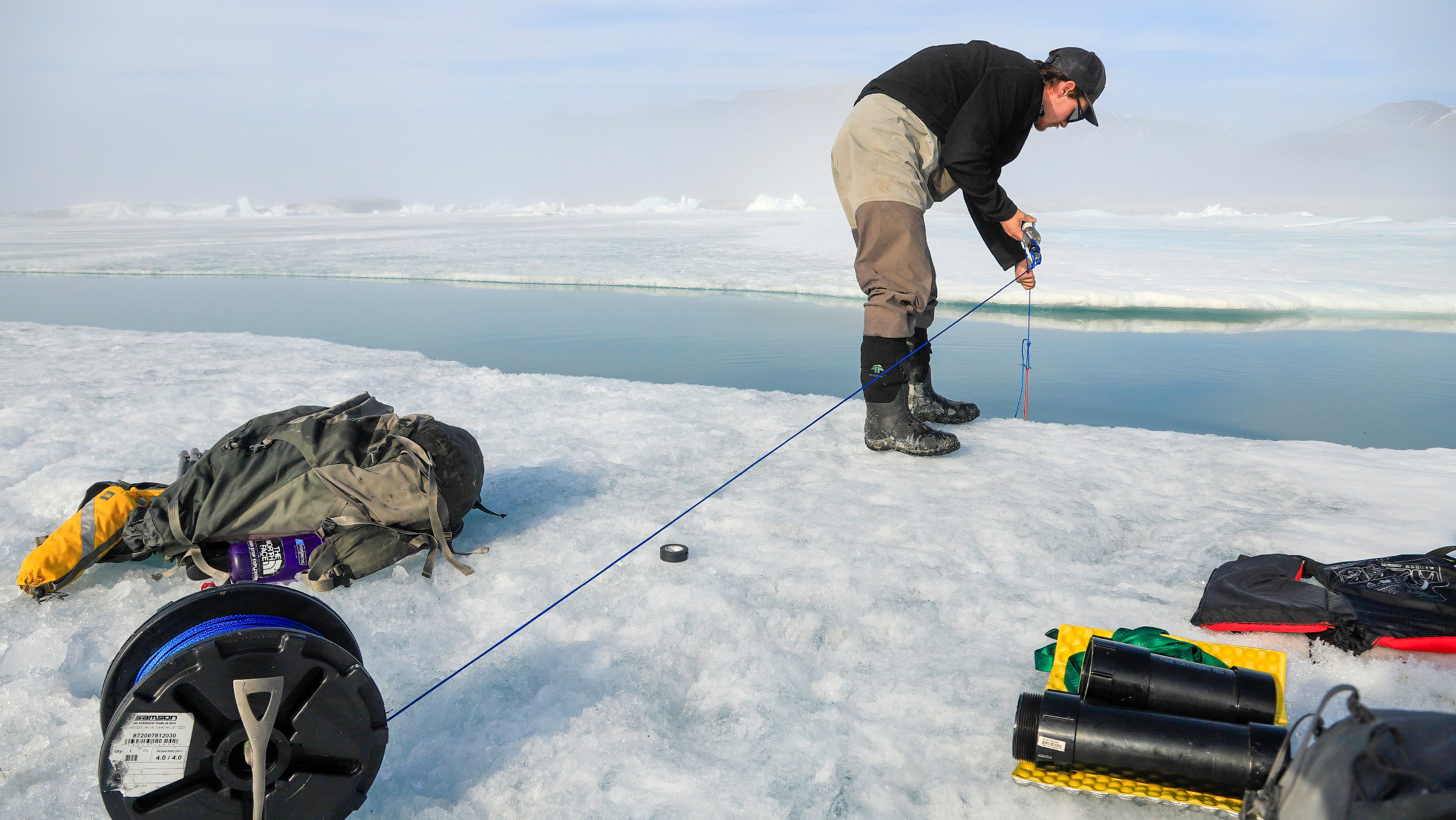 Jérémie Bonneau, lead author on the study and now an engineering professor at Université Laval, sets up monitoring equipment at Milne Fiord. (Photo: Supplied)