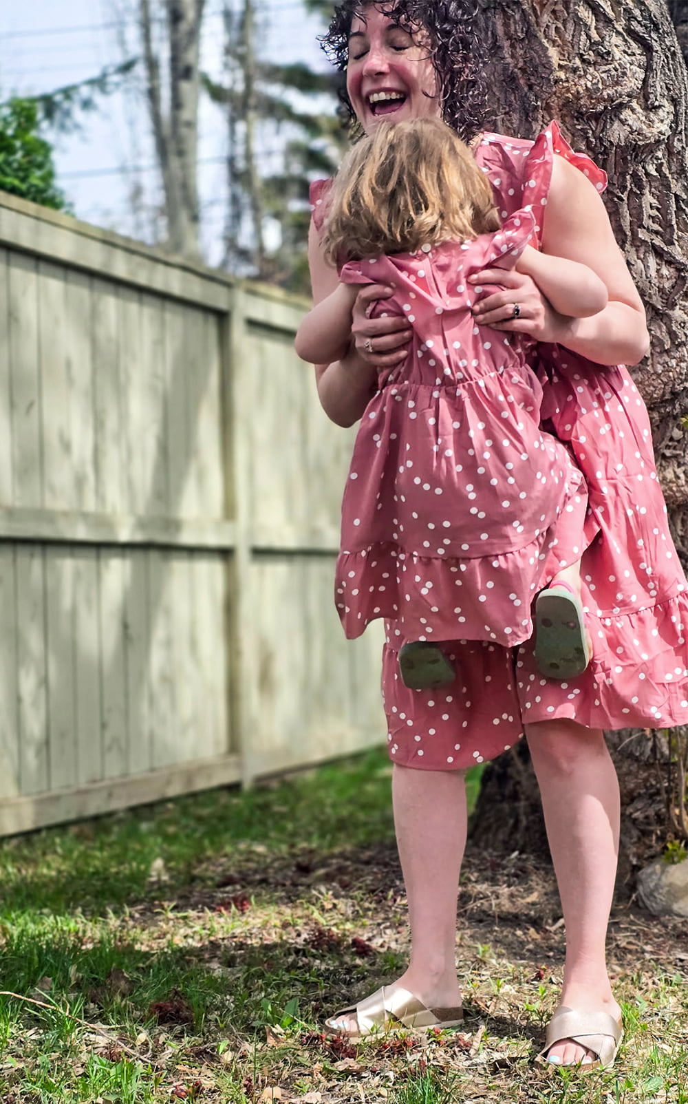 Lisa Harder smiles as she lifts up her daughter Ayla
