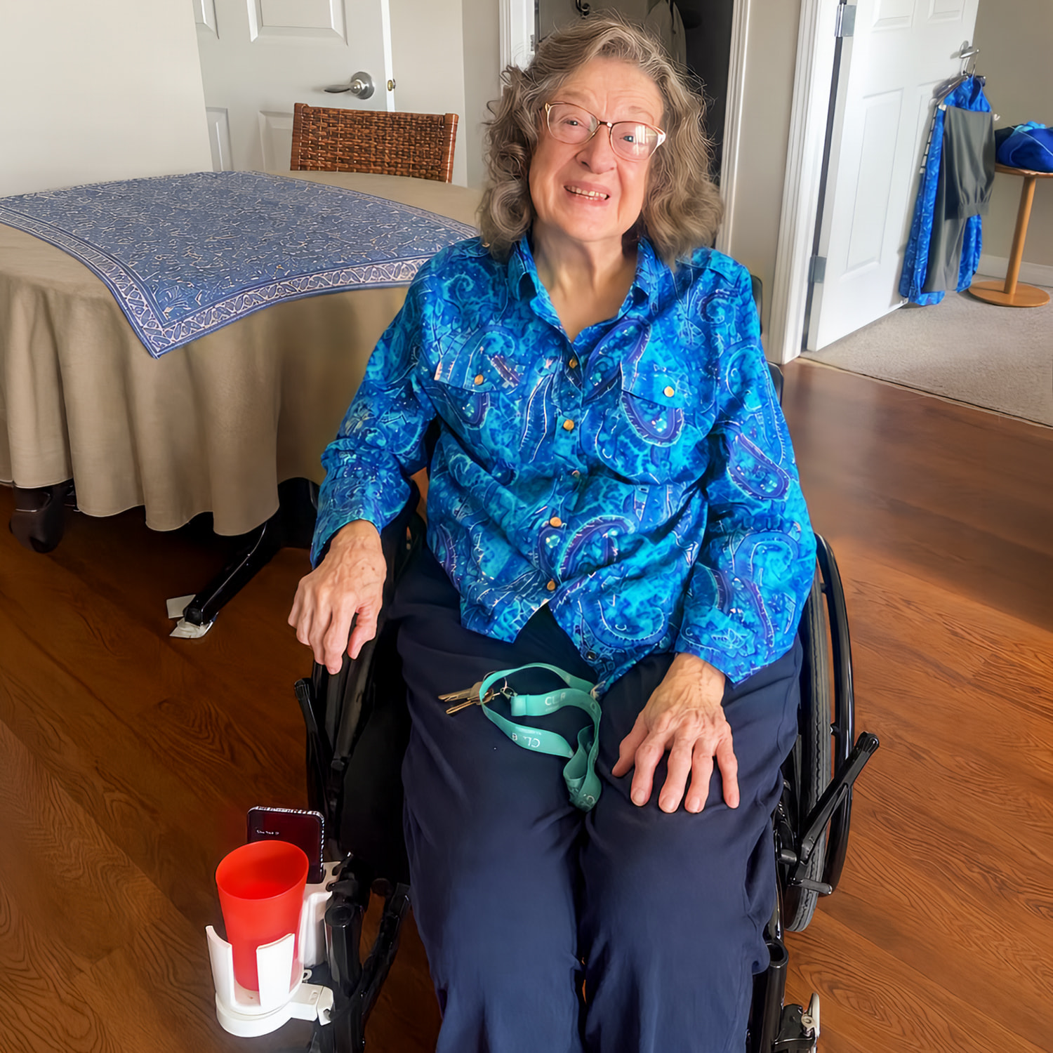 Vianna Aiello's grandmother with her custom 3D printed, wheelchair-mounted cup holder