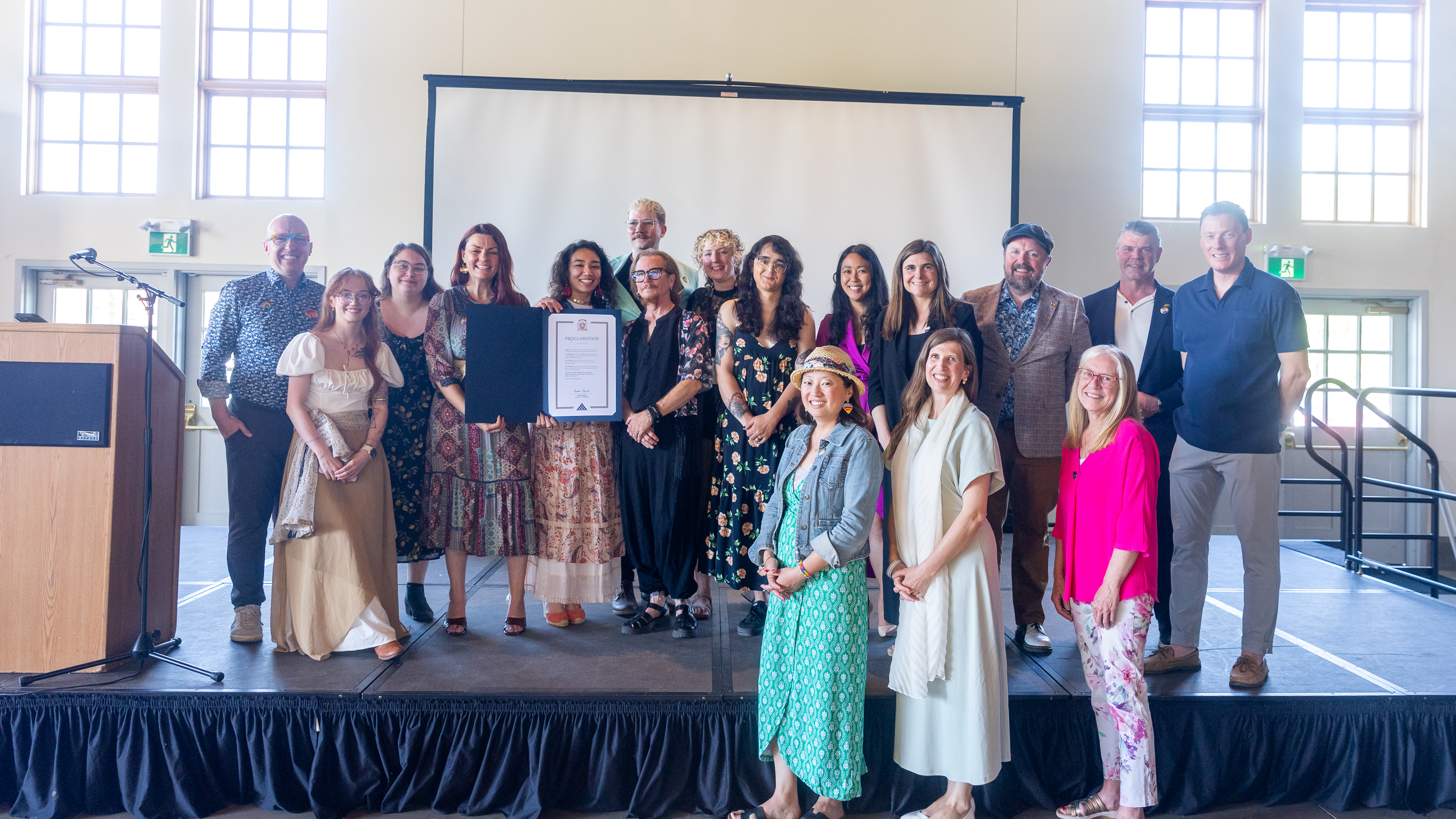 Fyrefly staff, Mayor Andrew Knack, and City Councillors with a proclamation
